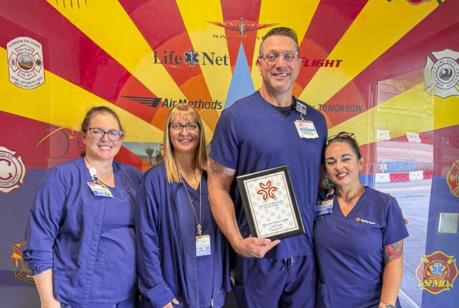 Smiles and appreciation fill the room as healthcare colleagues celebrate a Guardian Angel Award honoree for the outstanding care and support provided to patients and families.