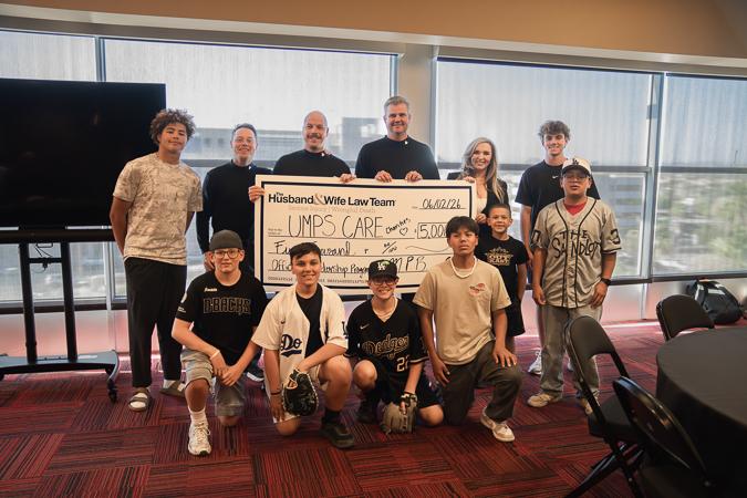 Inspiring young leaders to step up to the plate with a $15,000 UMPS CARE donation from the Husband & Wife Law Team.